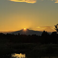 Golden Sunset Over Silhouetted Peaks